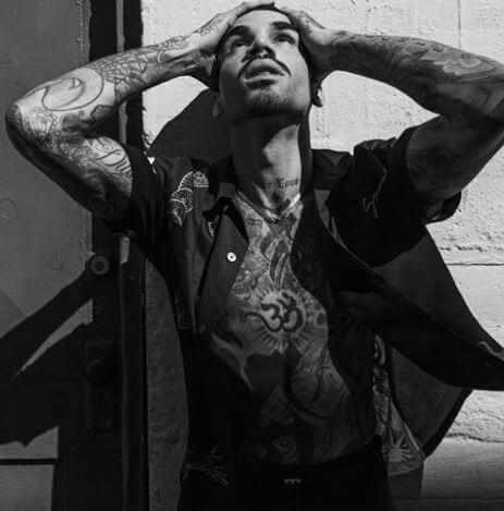 Miles Brockman Richie flaunting his tattoos.
